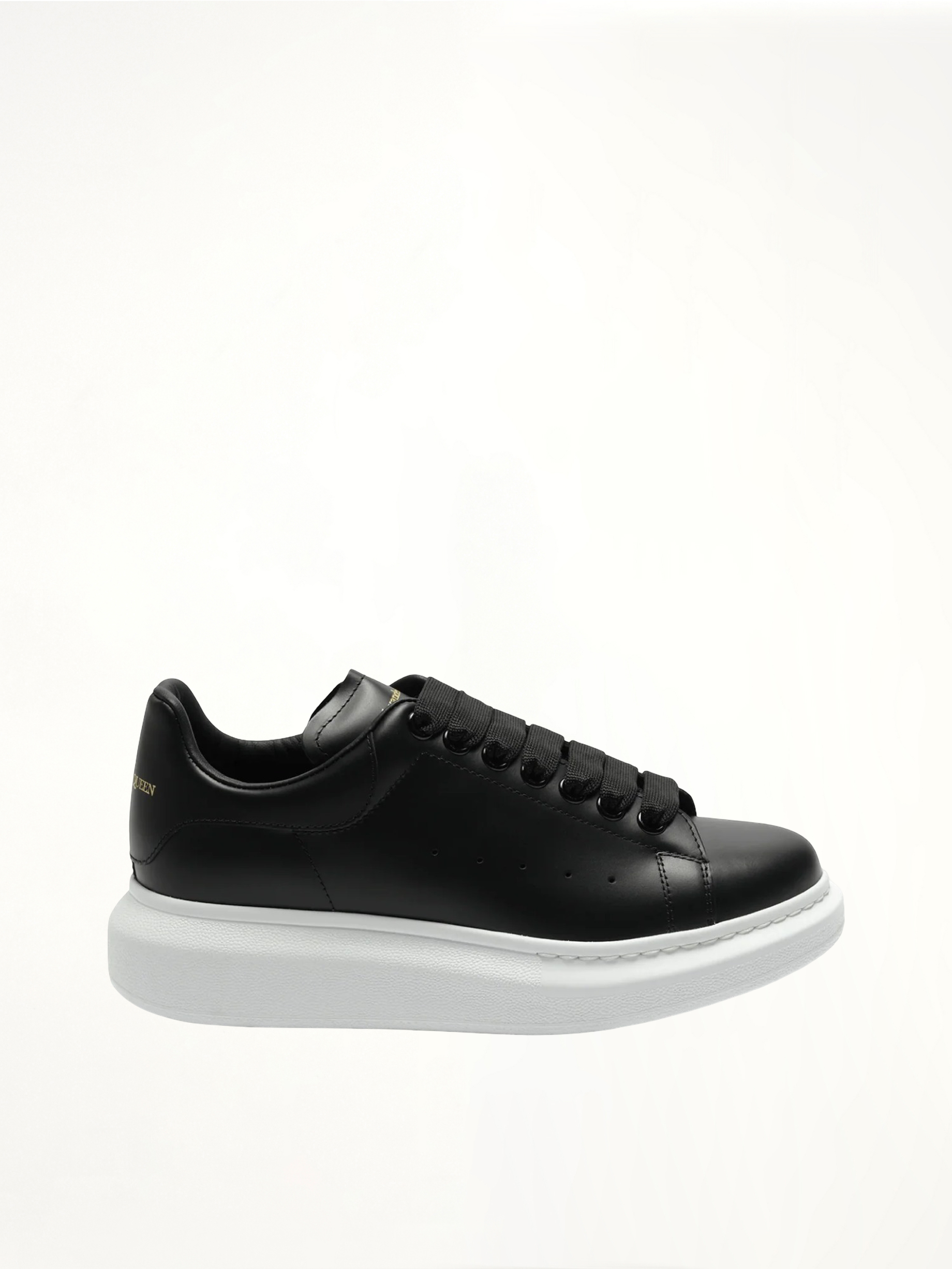 Larry Oversized Sneakers in Black/White Side View | ALEXANDER MCQUEEN