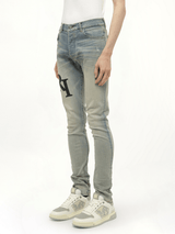 Staggered Logo Skinny Jeans in Antique Indigo/Black