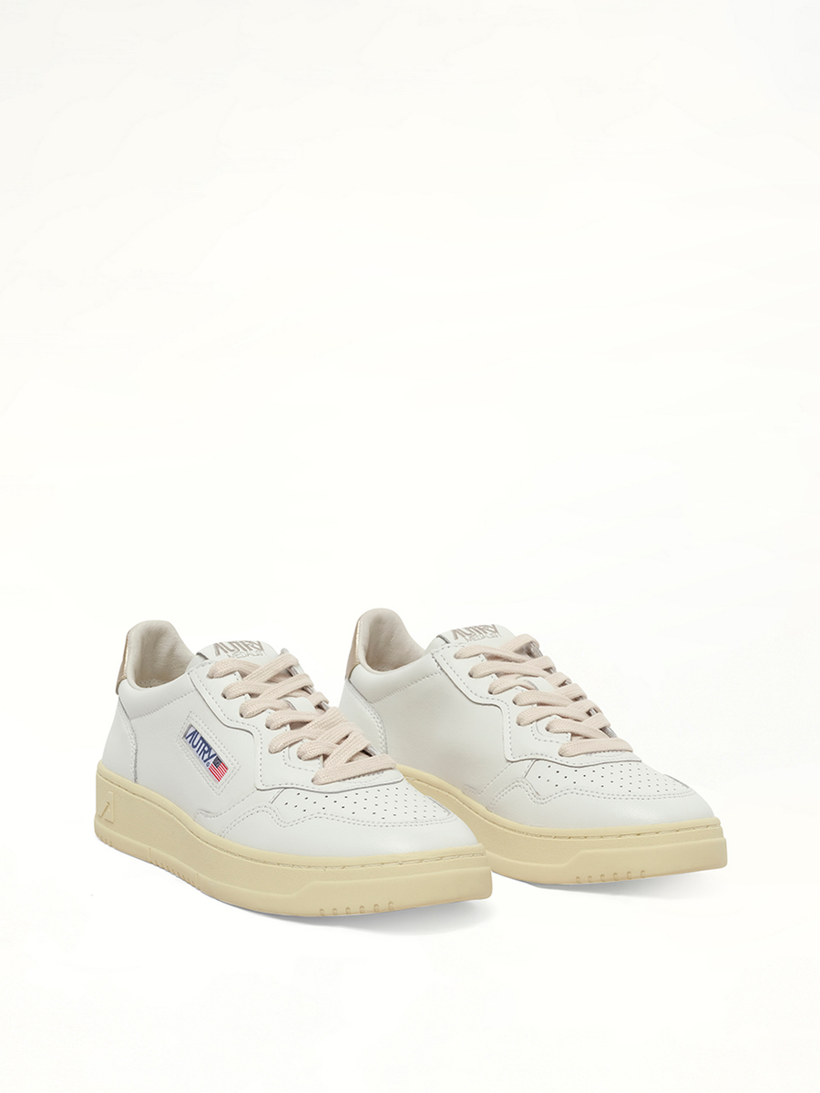 Medalist Low Sneakers in White/Gold Front View | AUTRY