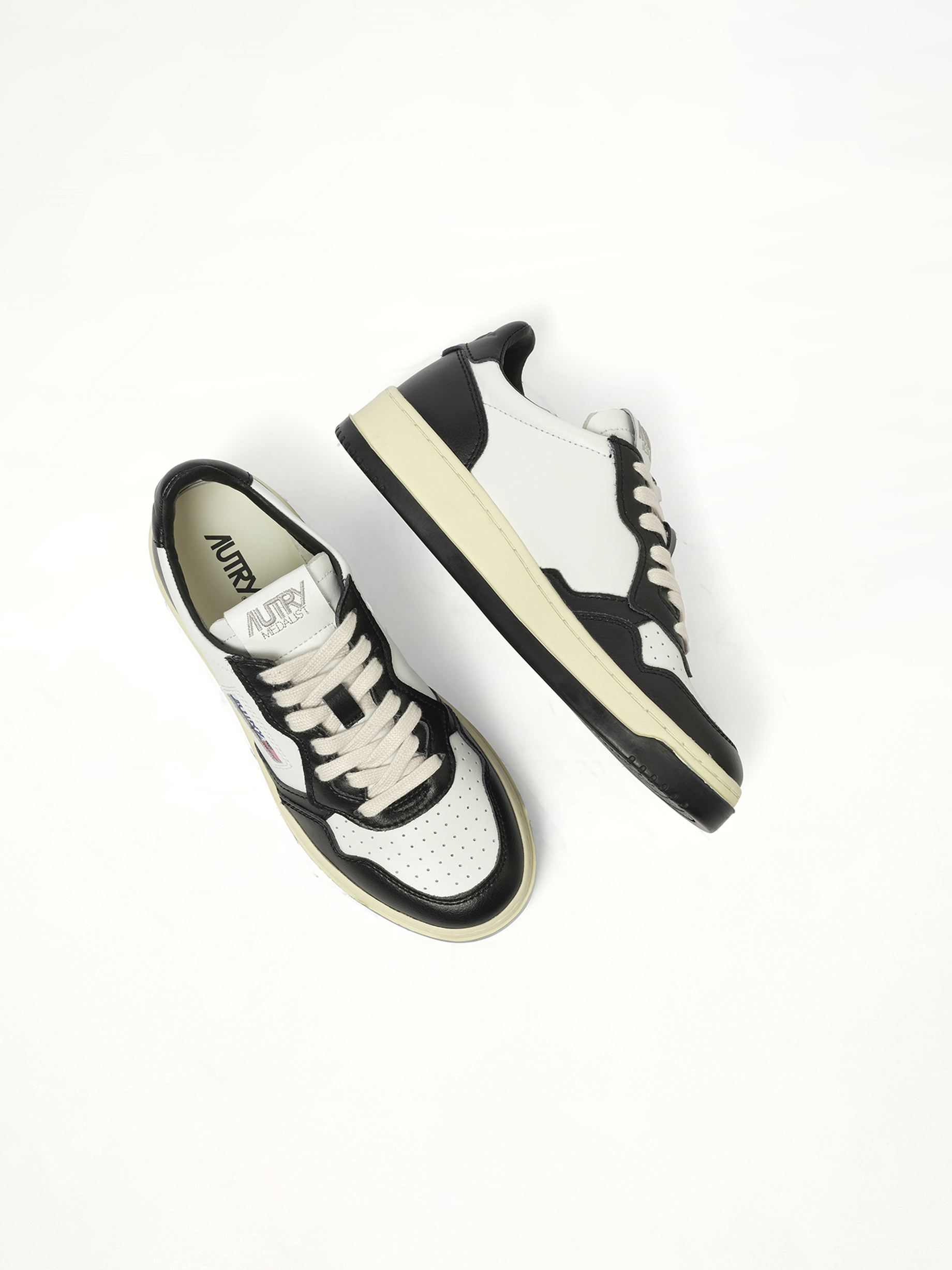 Medalist Low Bicolour Sneakers in White/Black Back View | AUTRY