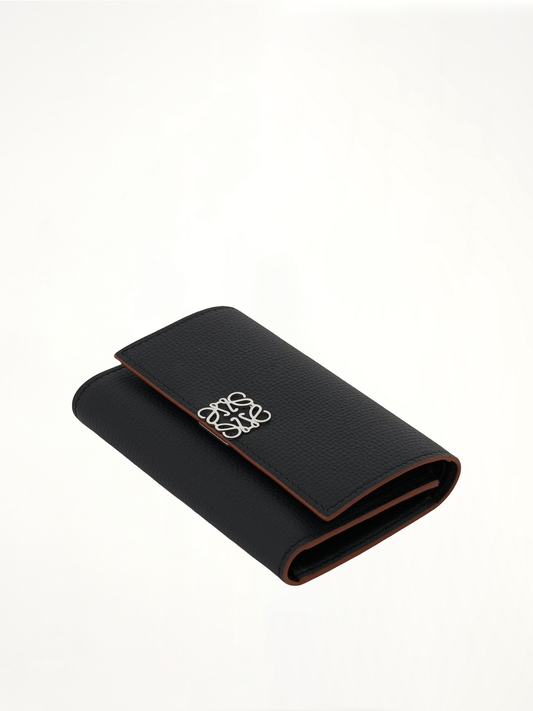 Anagram Small Vertical Wallet in Pebble Grain Calfskin in Black