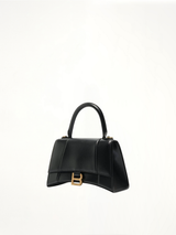 Hourglass Small Handbag in Box Calfskin in Black with Gold Plaque