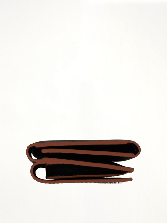 Anagram Trifold Wallet Pebble Grain Calfskin in Black