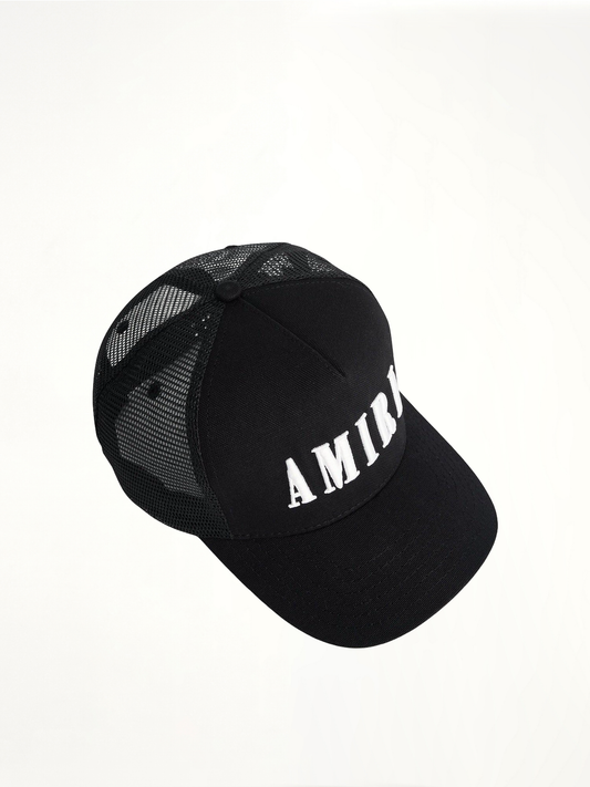 Amiri Core Logo Trucker Hat in Black/White