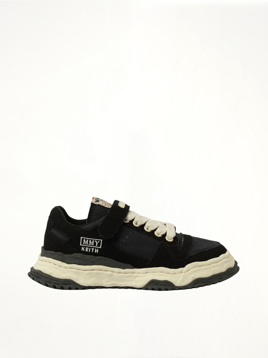 KEITH OG Low Top Sneaker in Black/White Side View | MAISON MIHARA YASUHIRO