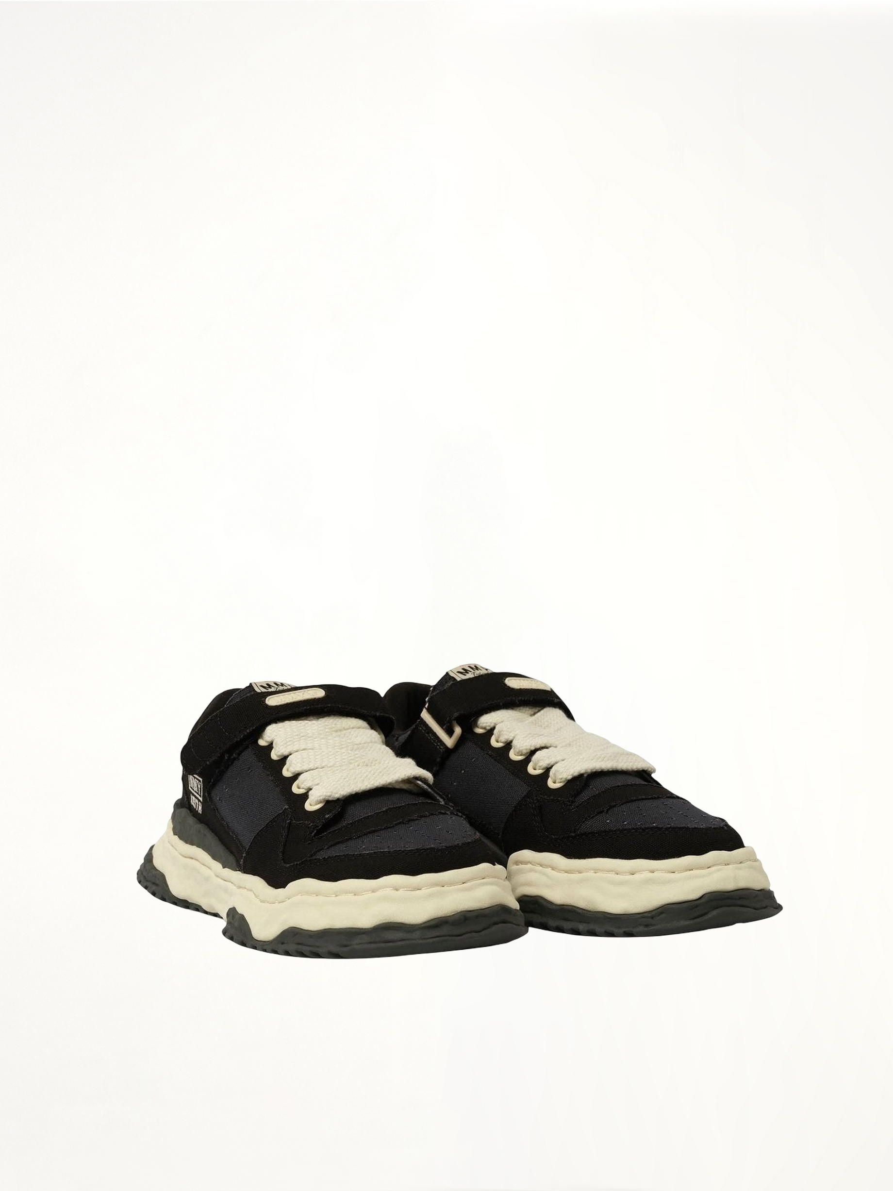 KEITH OG Low Top Sneaker in Black/White Front View | MAISON MIHARA YASUHIRO