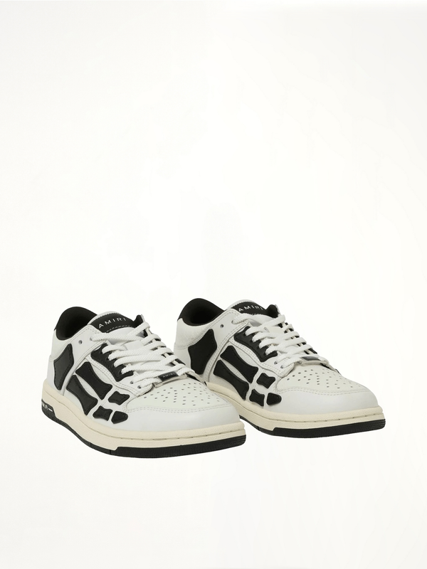 Skeleton Low Top Sneaker in White/Black Front View | AMIRI