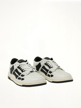 Skeleton Low Top Sneaker in White/Black Front View | AMIRI