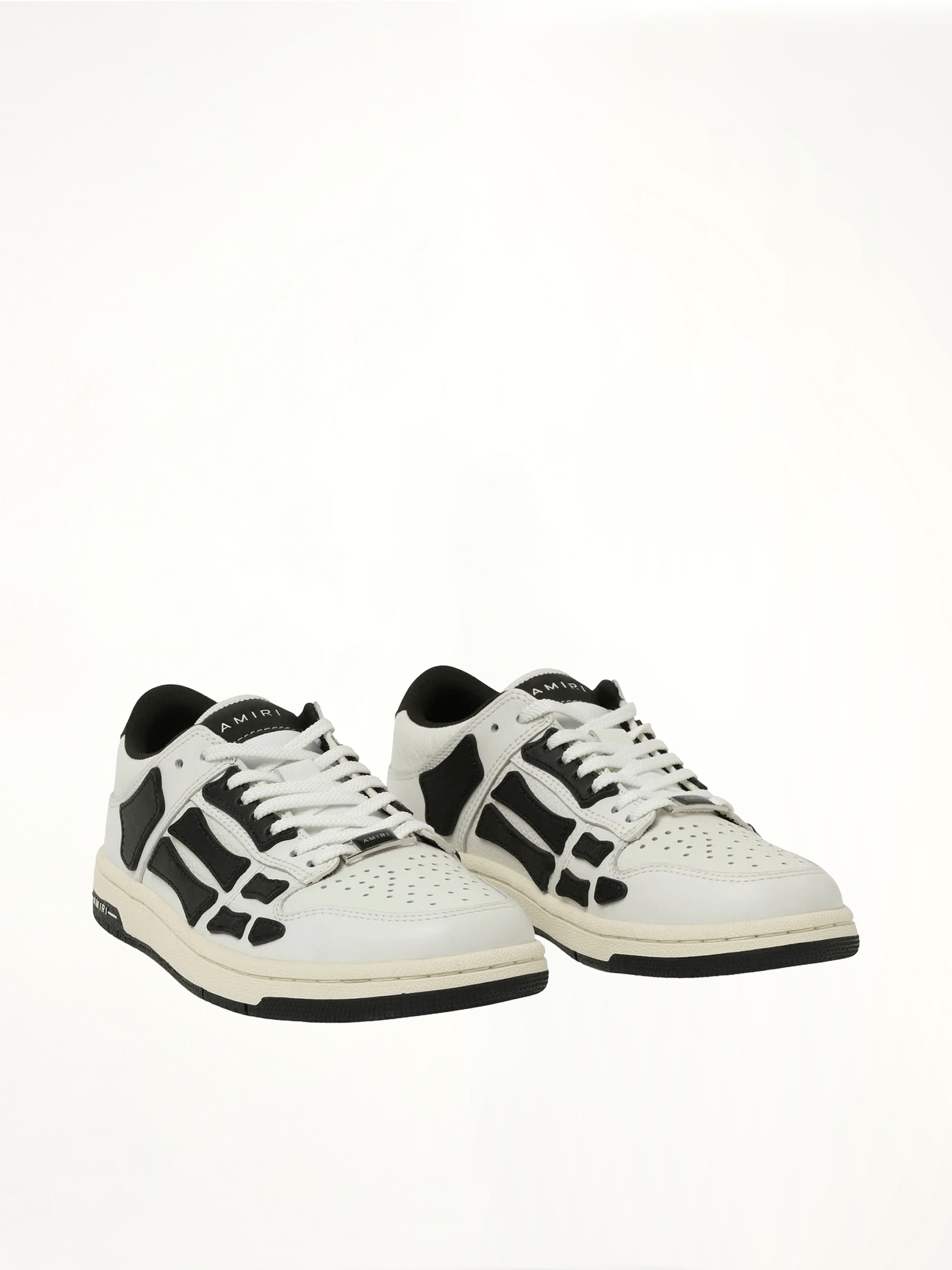 Skeleton Low Top Sneaker in White/Black Front View | AMIRI