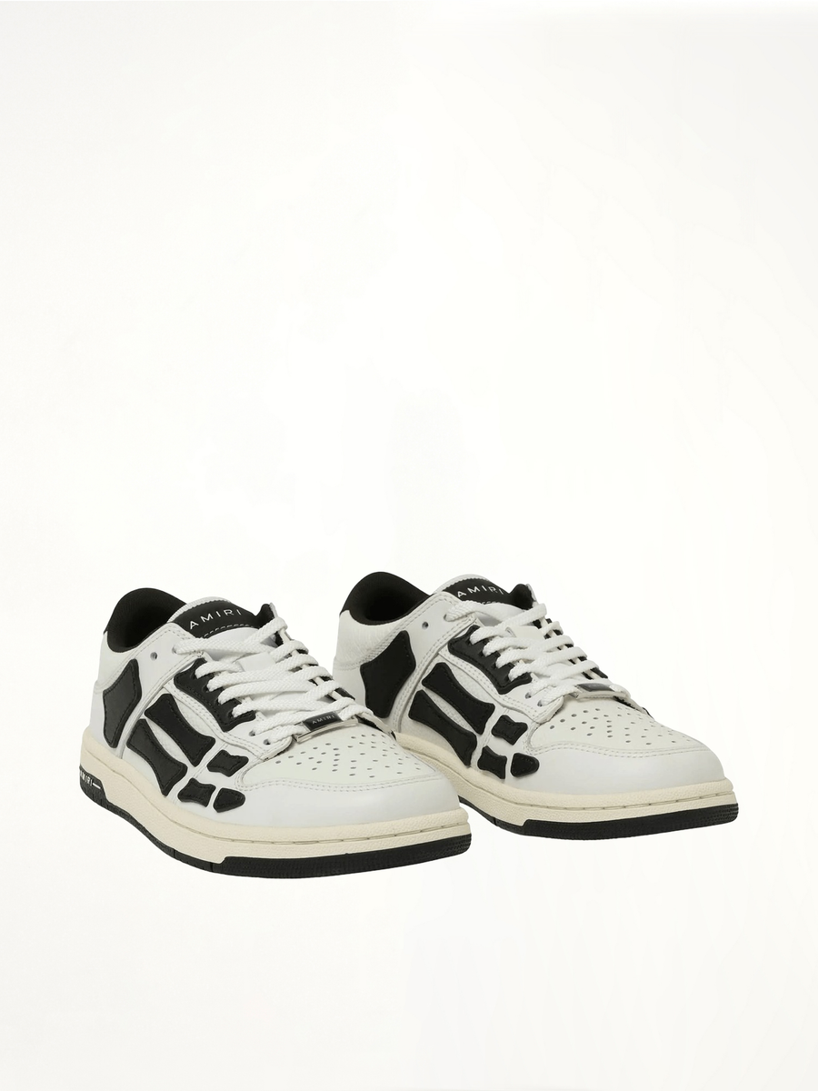 Skeleton Low Top Sneaker in White/Black Front View | AMIRI