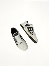 Skeleton Low Top Sneaker in White/Black Top View | AMIRI