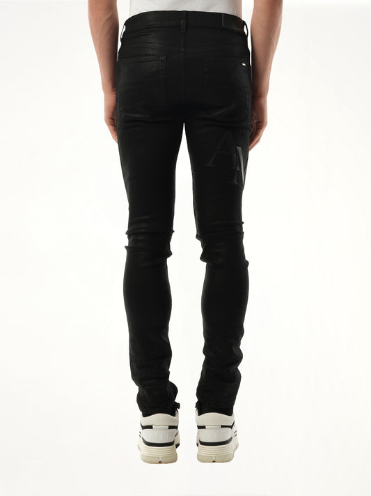 Waxed Staggered Logo Skinny Jeans in Black Wax