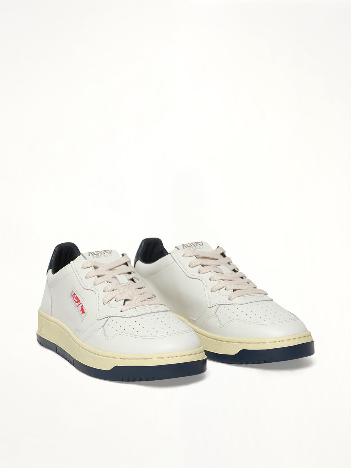Maison Kitsune Medalist Sneaker in White/Blue Front View | AUTRY