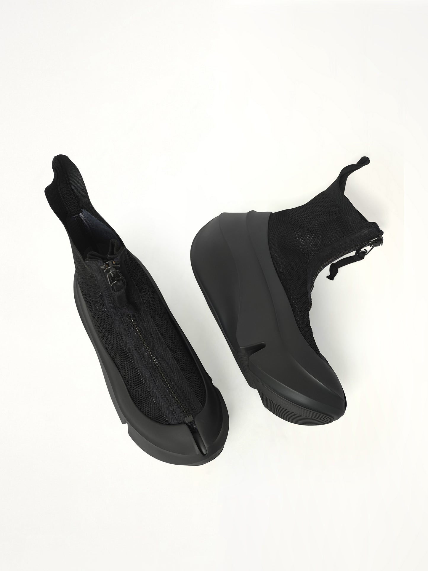 UC X Grounds Sneaker in Black