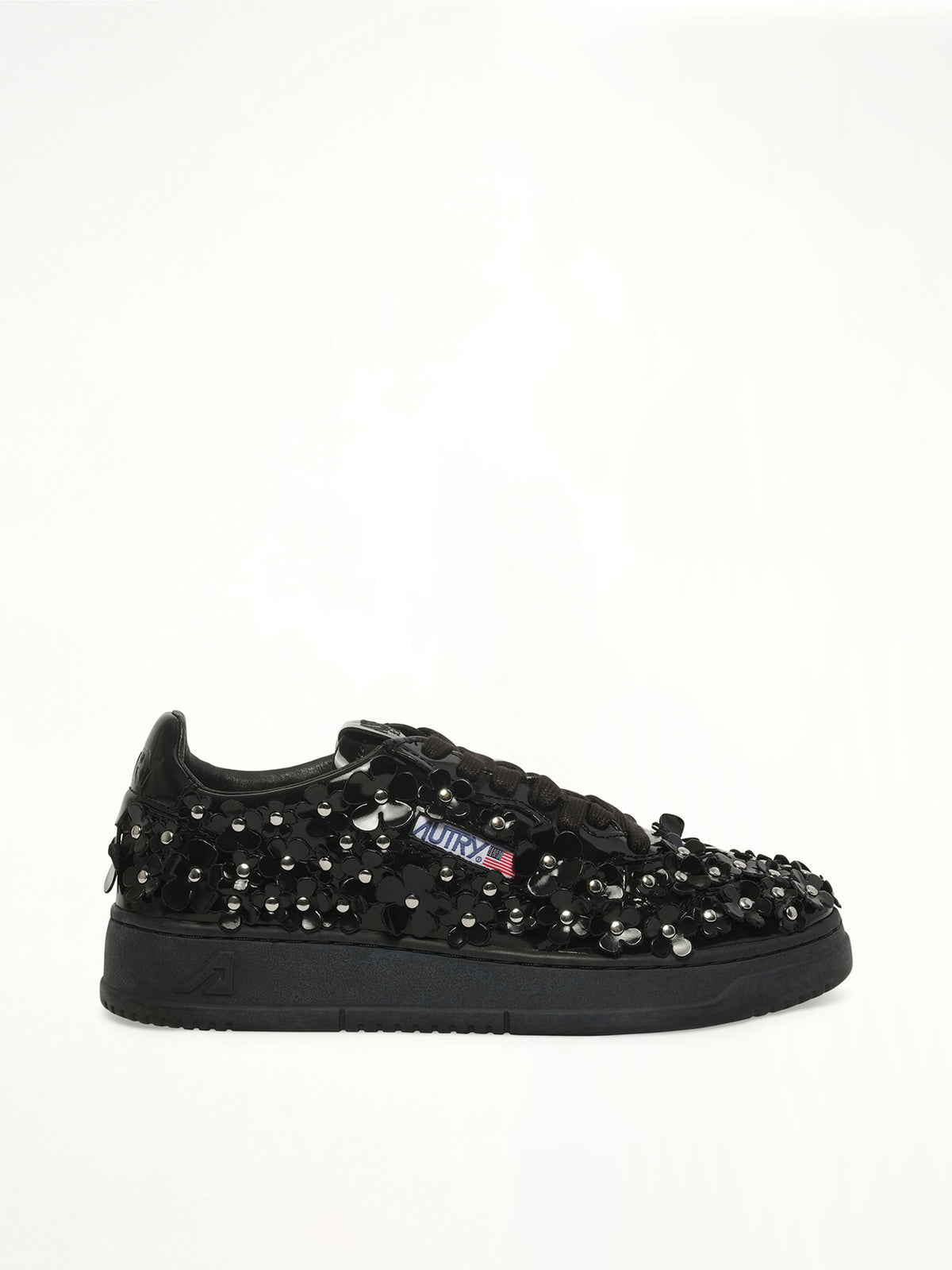 Medalist Low Patent Flower Sneaker in Black Side View | AUTRY