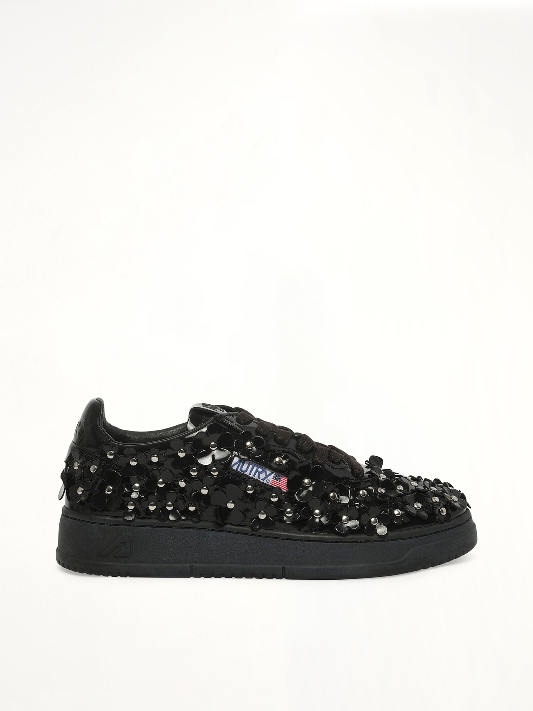 Medalist Low Patent Flower Sneaker in Black Side View | AUTRY