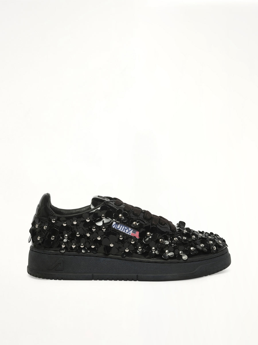 Medalist Low Patent Flower Sneaker in Black Side View | AUTRY