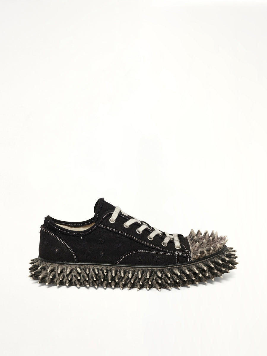 Dirty Spike Toe  Cap Canvas Sneaker in Black Side View | DOUBLET