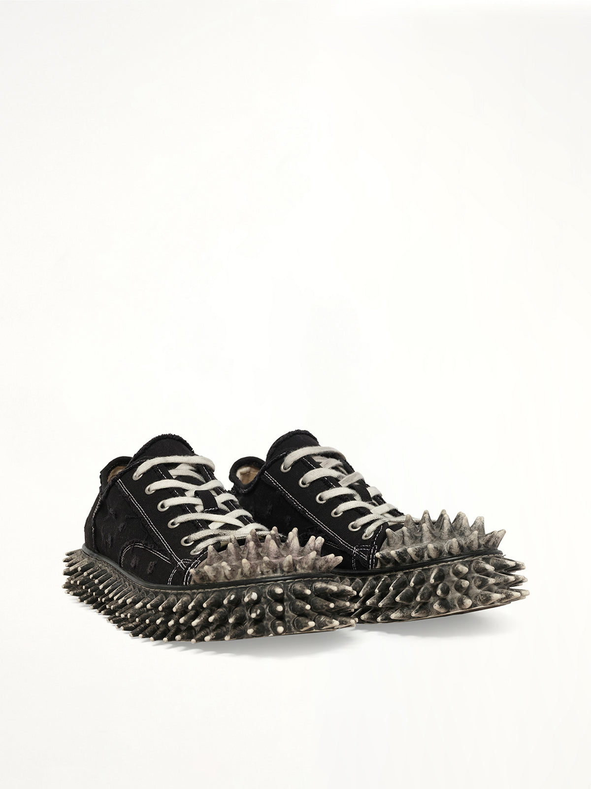 Dirty Spike Toe  Cap Canvas Sneaker in Black Front View | DOUBLET