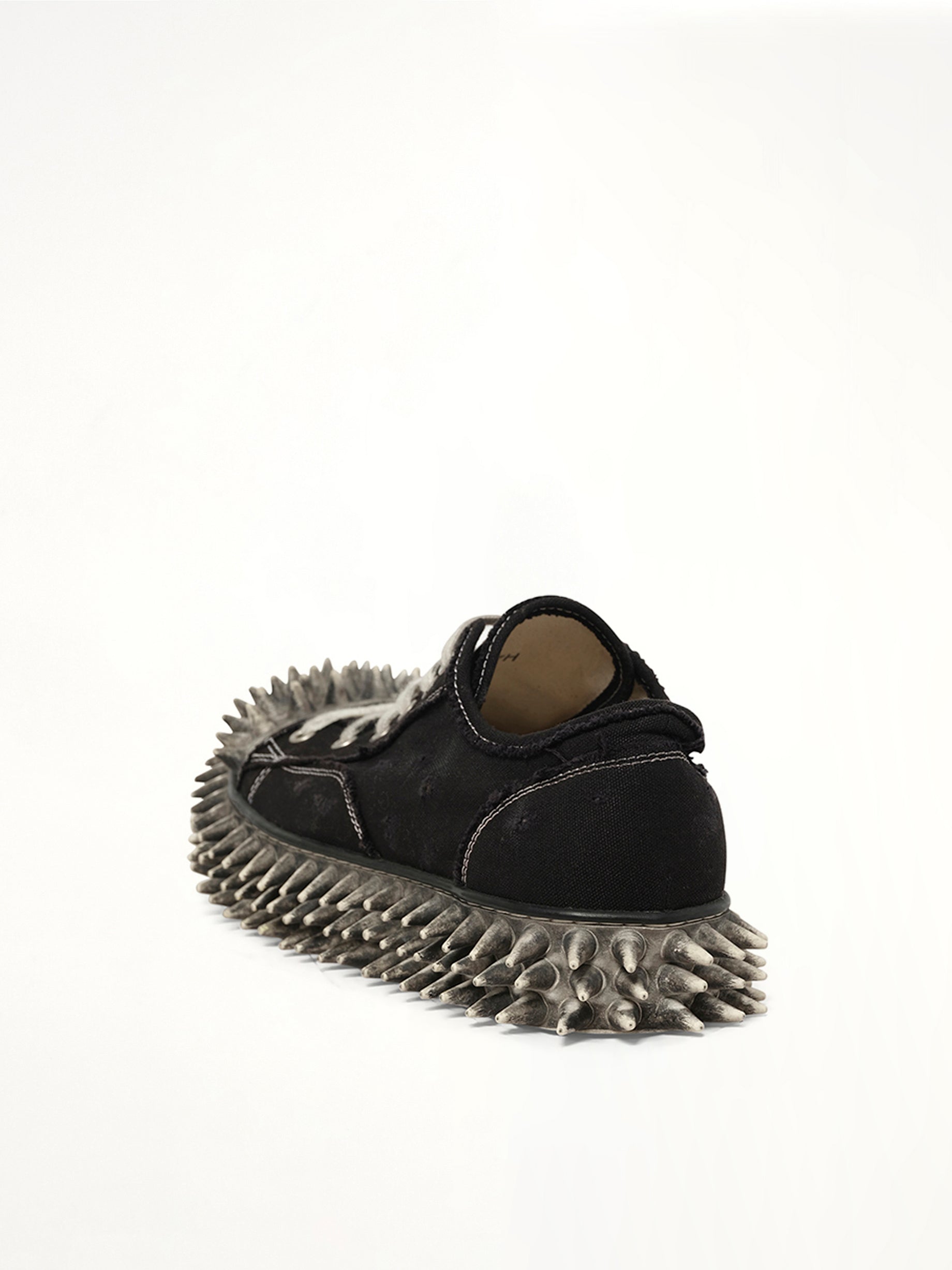 Dirty Spike Toe  Cap Canvas Sneaker in Black Back View | DOUBLET