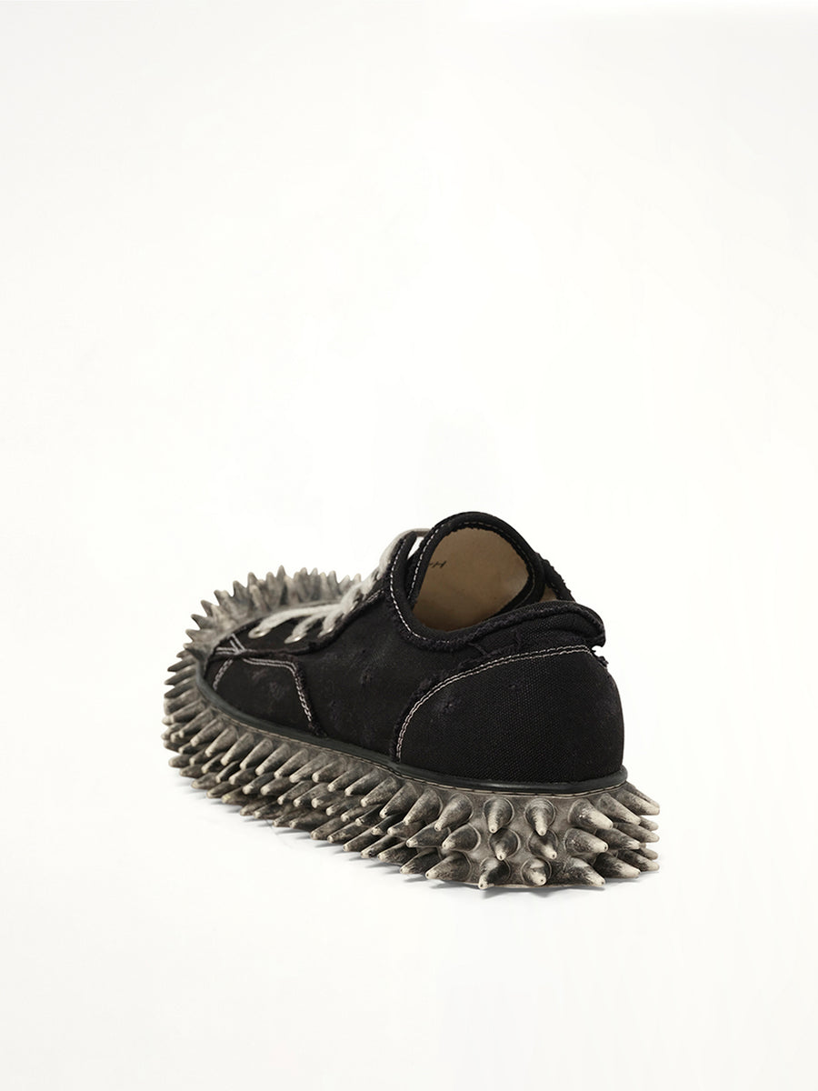 Dirty Spike Toe  Cap Canvas Sneaker in Black Back View | DOUBLET