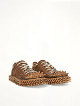 Dirty Spike Toe  Cap Canvas Sneaker in Brown Front View | DOUBLET