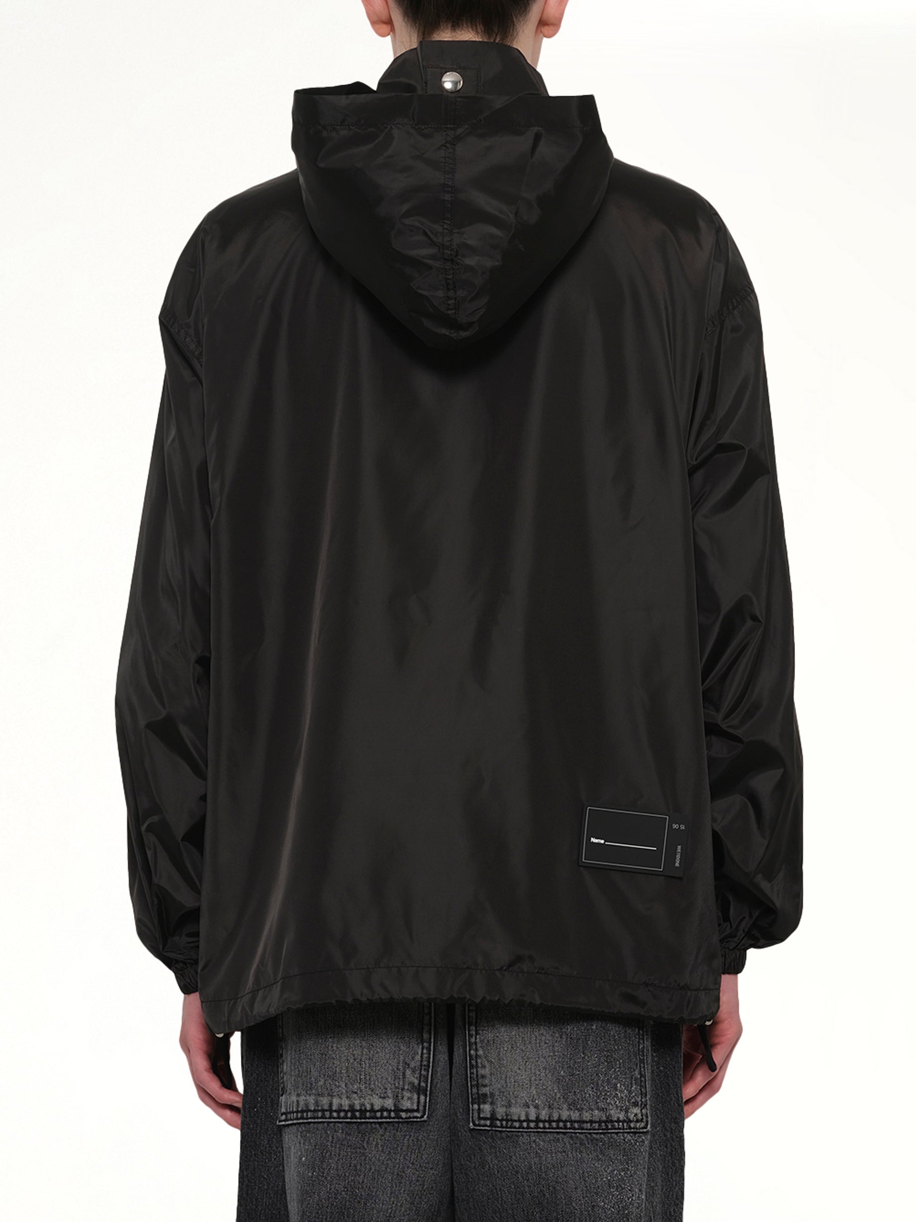 WE11DONE , Logo Windbreaker Jacket in Black Back View from MARAIS