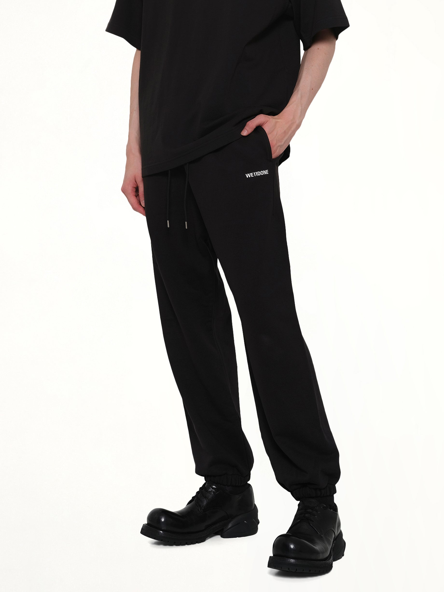WE11DONE Logo Medium Lounge Pants in Black Detail Shot from MARAIS