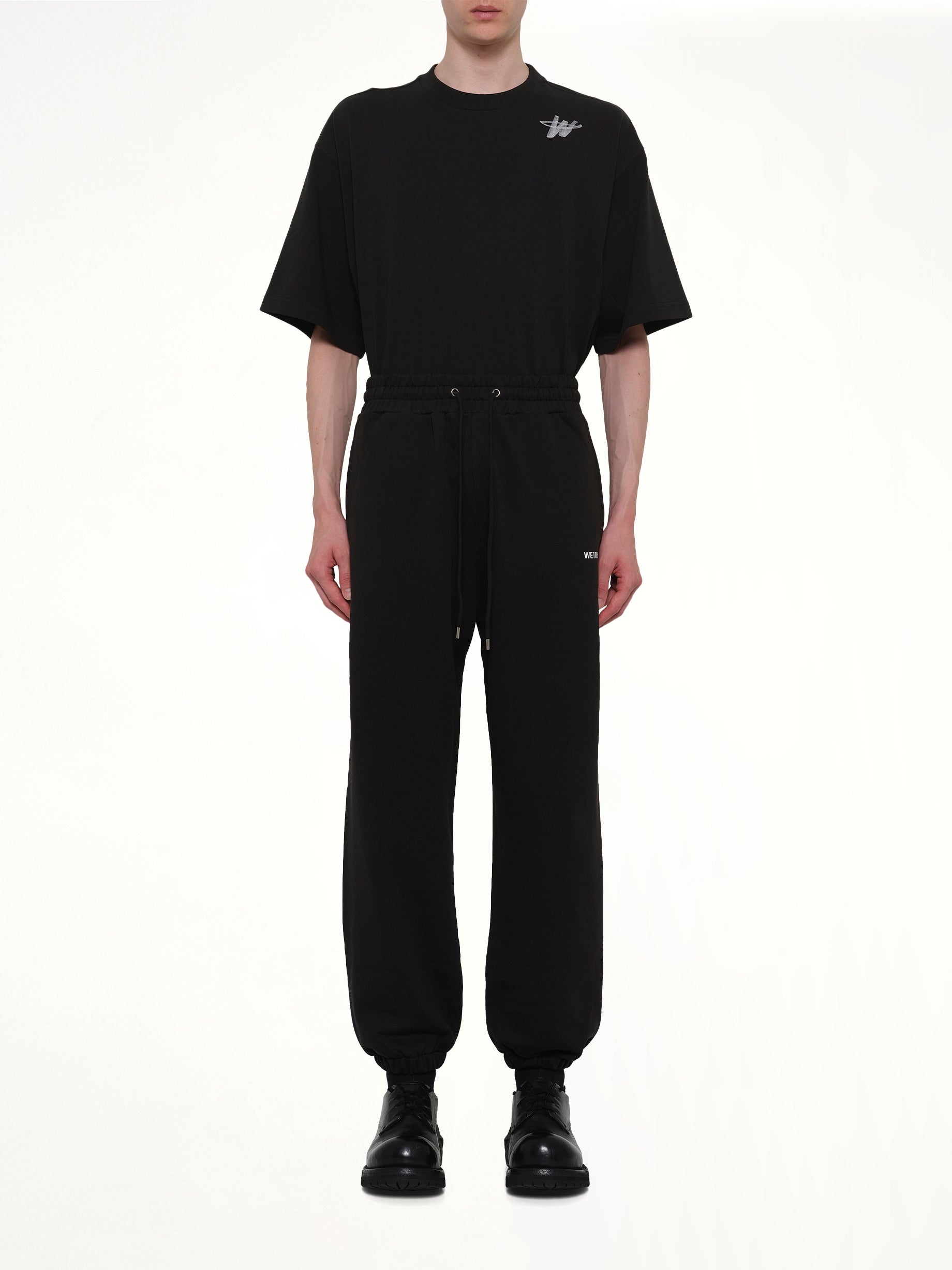 WE11DONE Logo Medium Lounge Pants in Black Model View from MARAIS