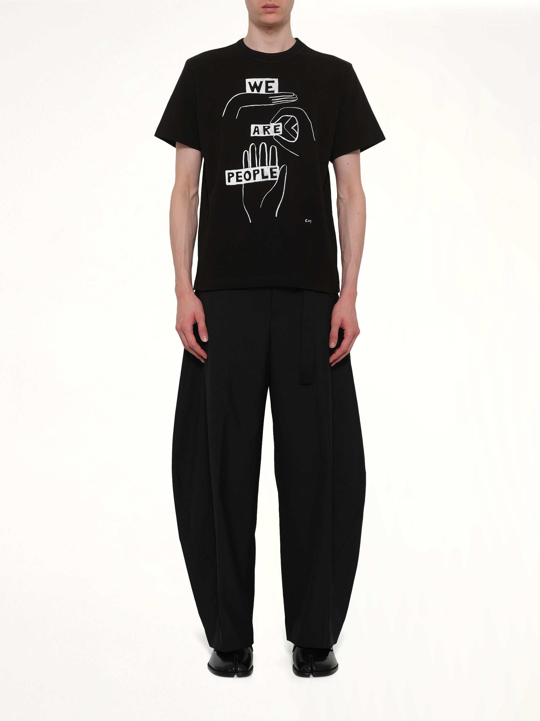 SACAI Geoff "We Are People" T-Shirt in Black Model View from MARAIS