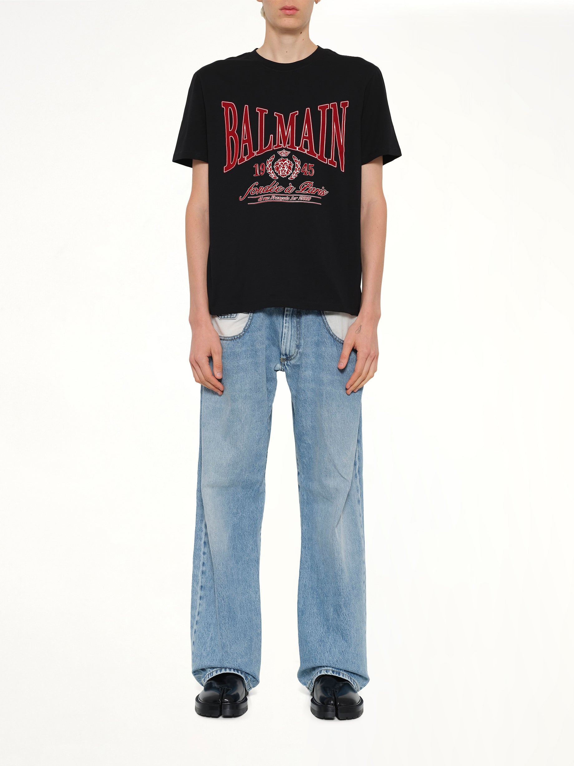 BALMAIN Balmain College Flock T-Shirt in Black Model View from MARAIS