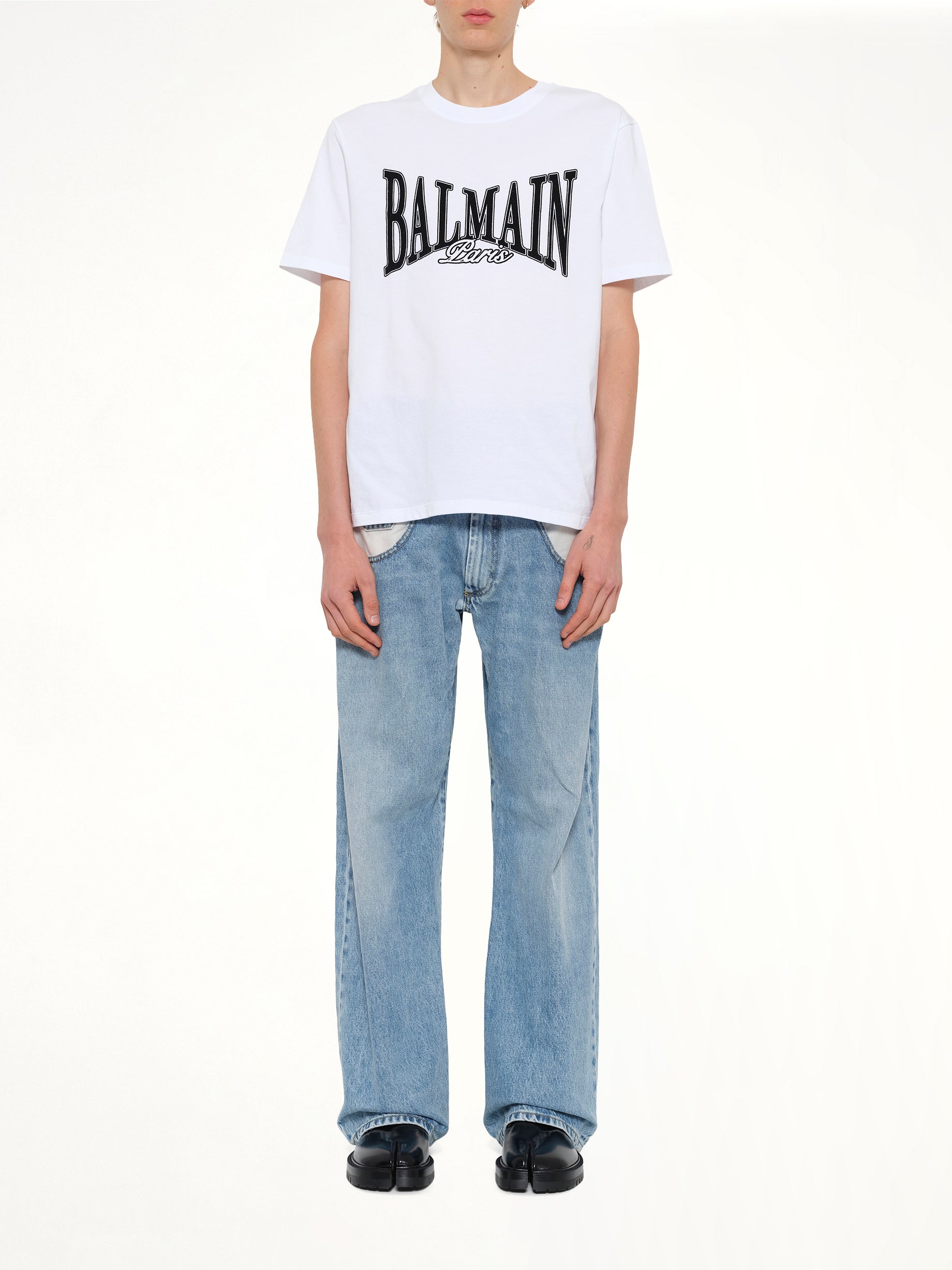 BALMAIN Balmain College Flock T-Shirt in White/Black Model View from MARAIS