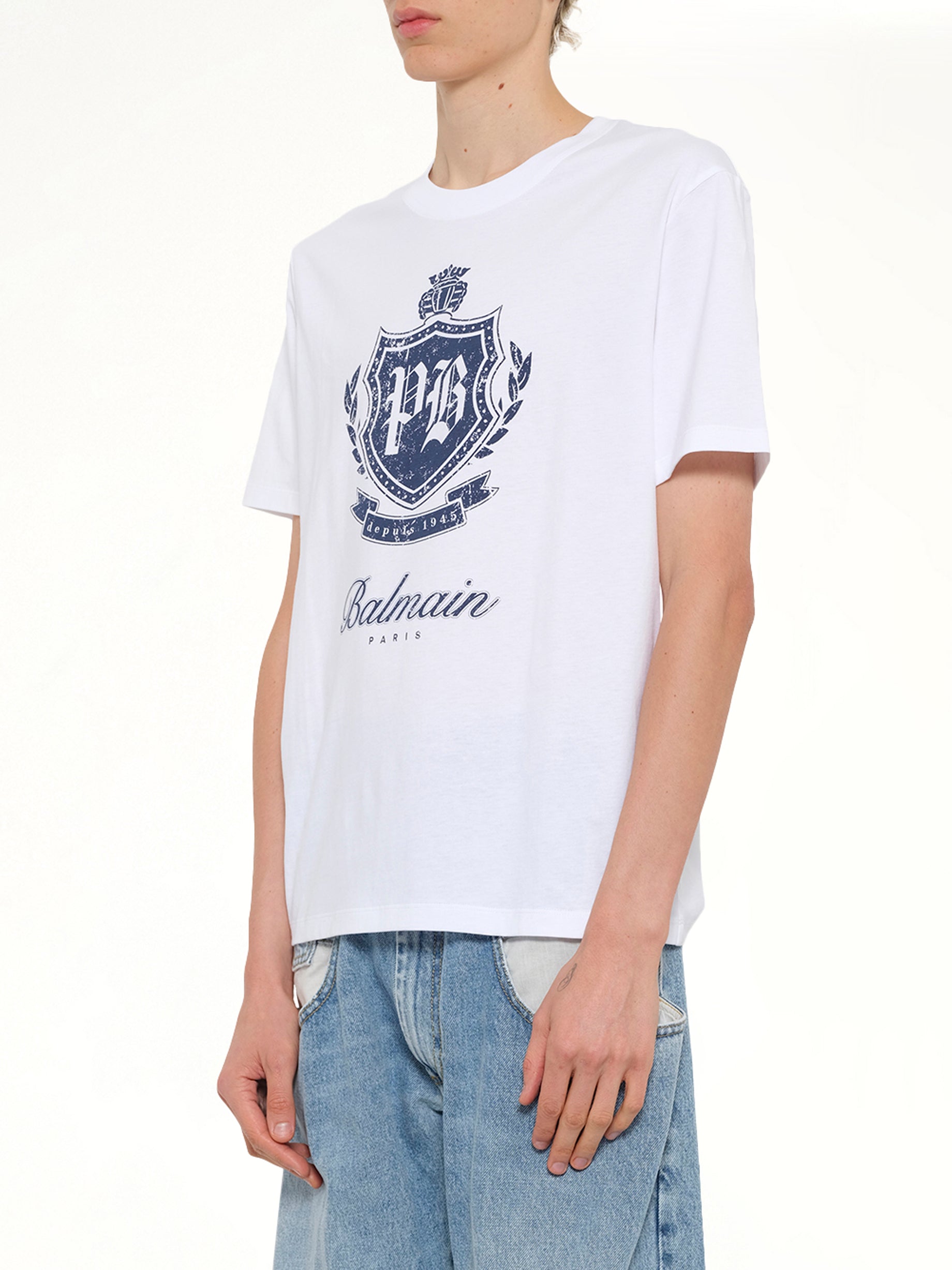BALMAIN College Emblem Print T-Shirt in White/Blue Side View from MARAIS