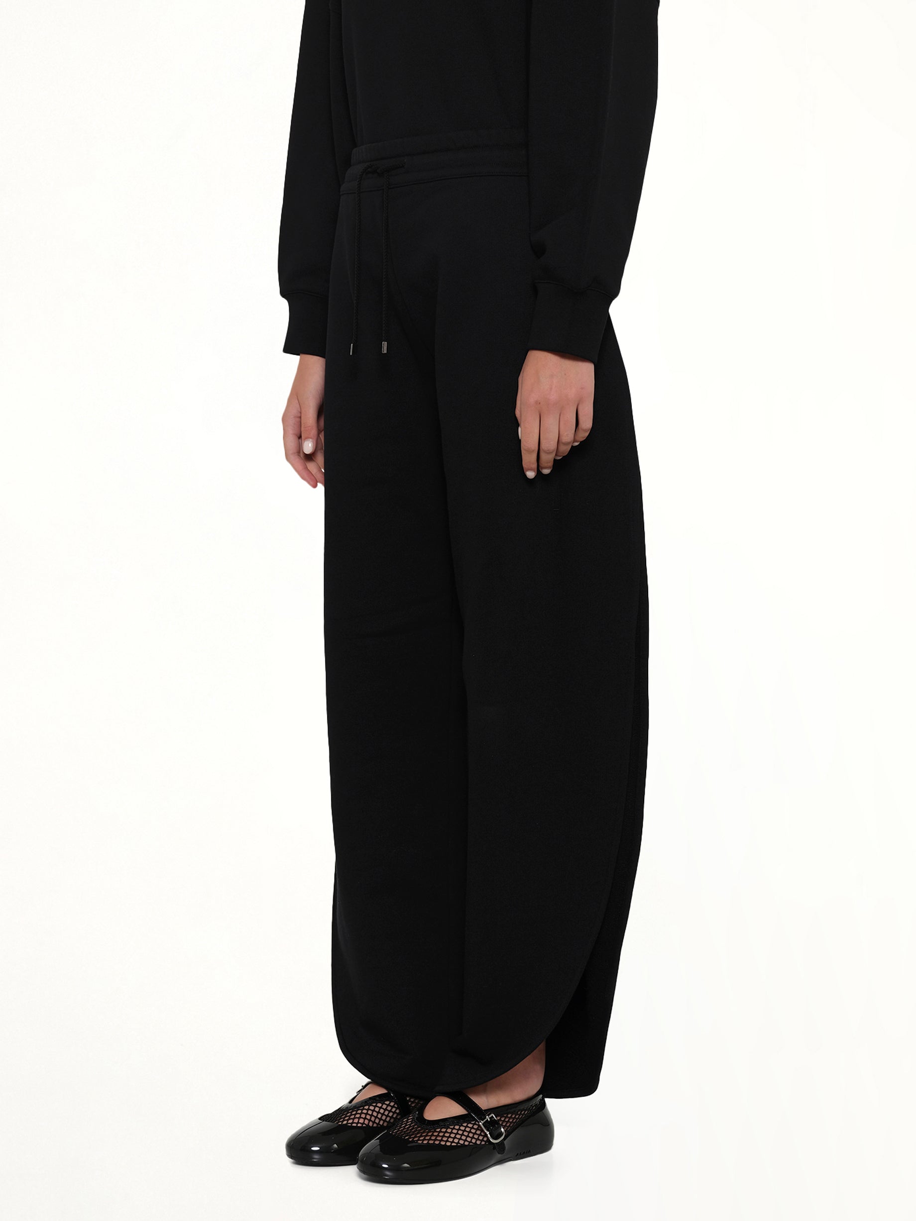 ALAIA Petal Joggers in Black Side View from MARAIS