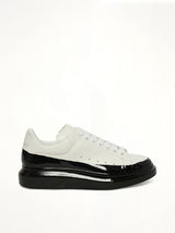 Larry Oversized Dipped Sneaker in White/Black Side View | ALEXANDER MCQUEEN