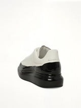 Larry Oversized Dipped Sneaker in White/Black Back View | ALEXANDER MCQUEEN