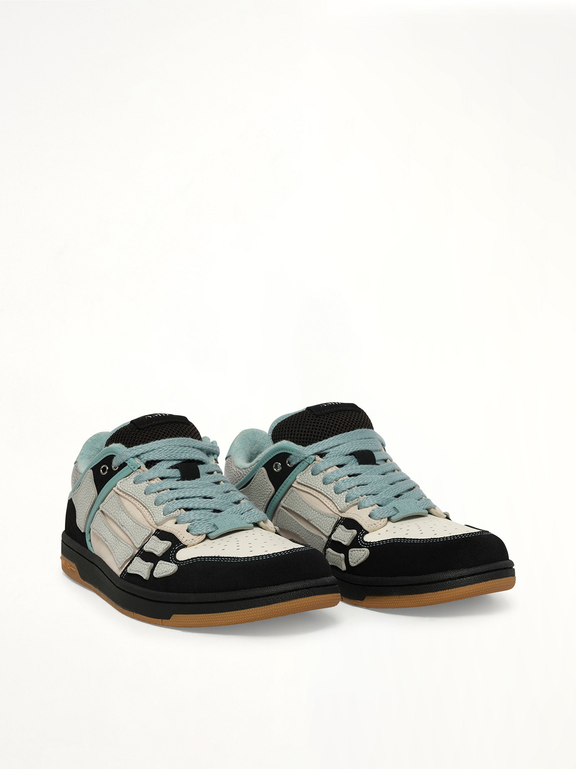 XL Skel Top Low Sneaker in Black Front View | AMIRI