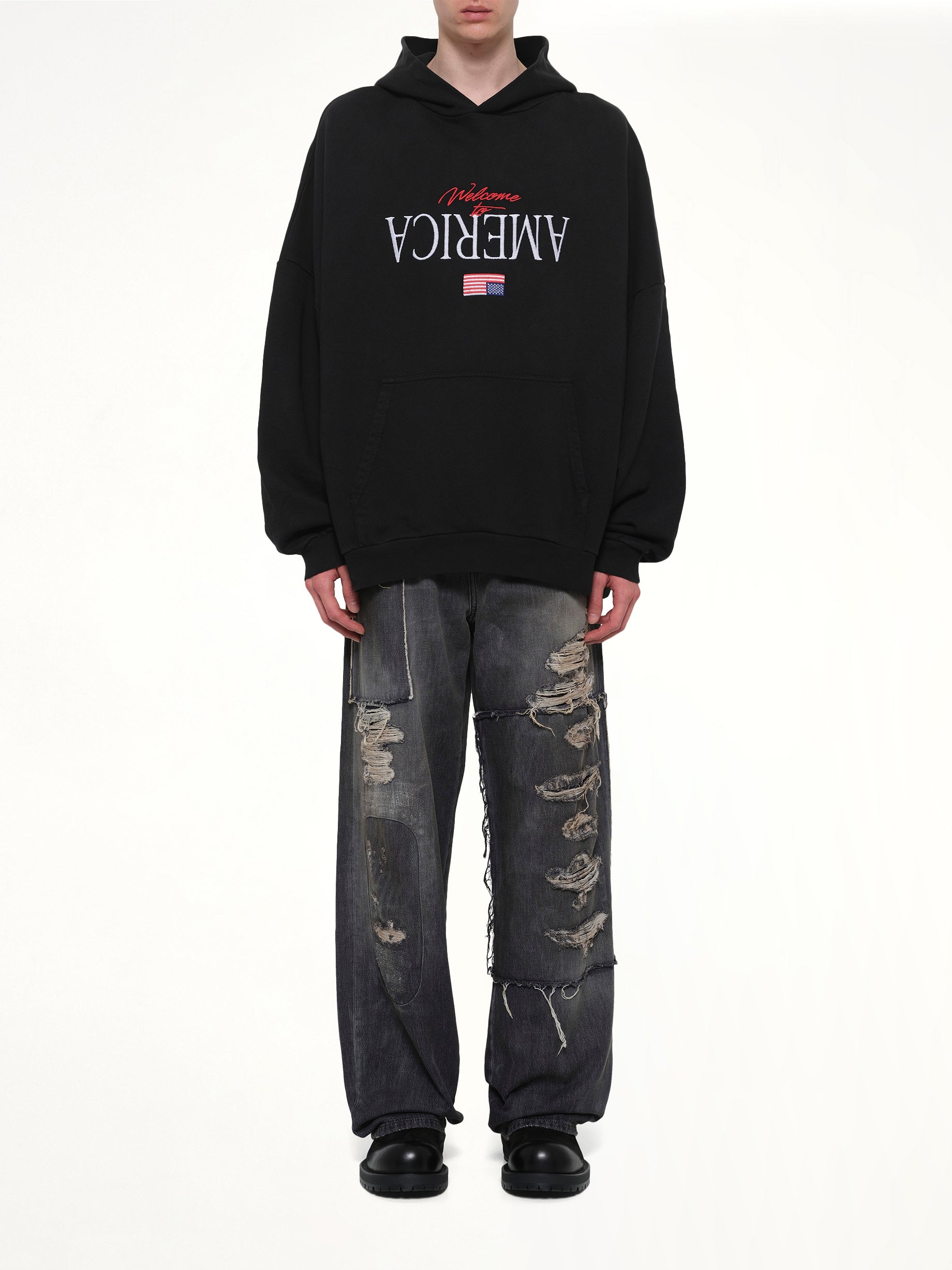 WILLY CHAVARRIA Welcome To America Hooligan Hoodie in Black Model View from MARAIS