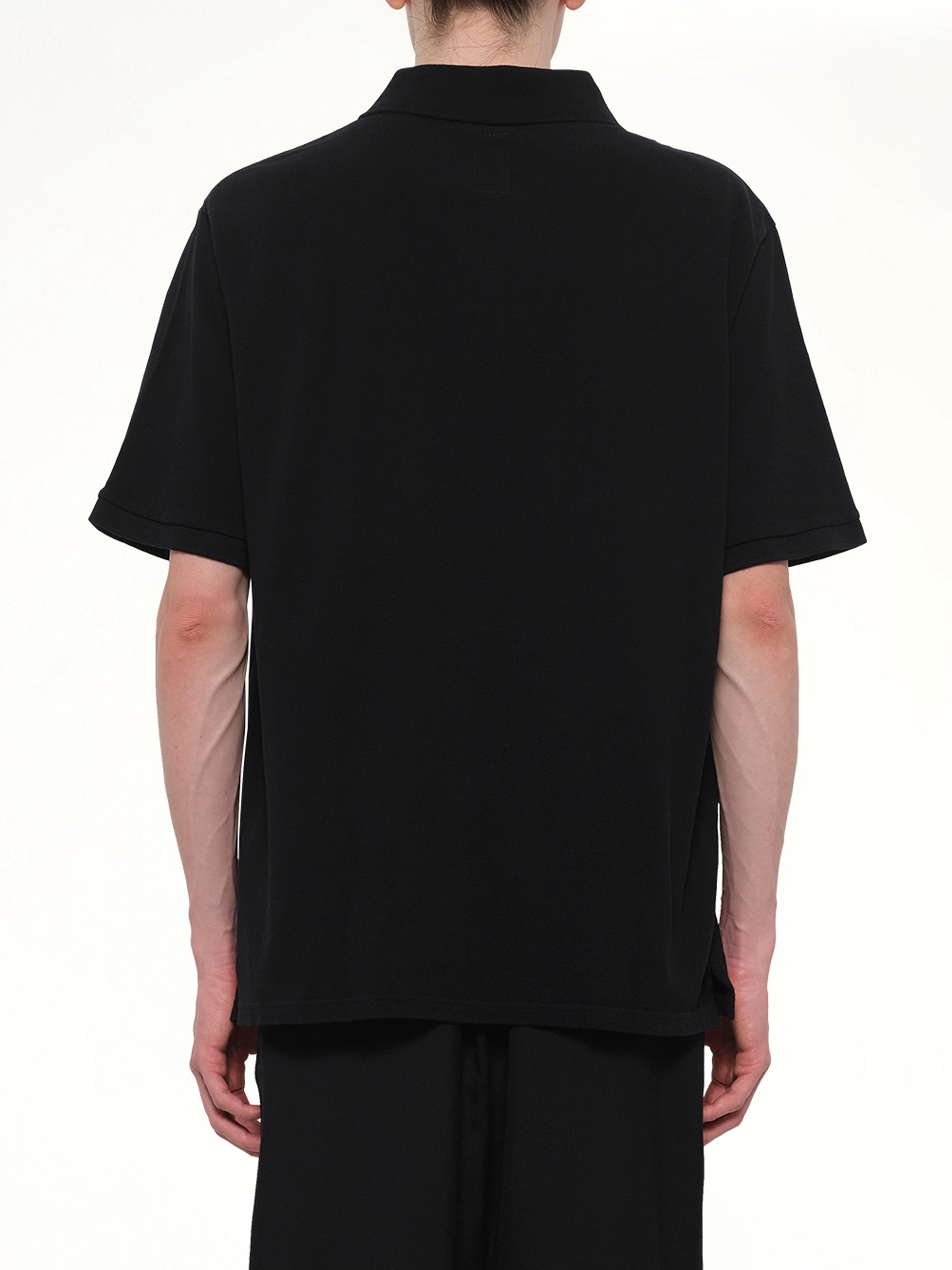 VOWELS S/S Pique Polo in Black Back View from MARAIS