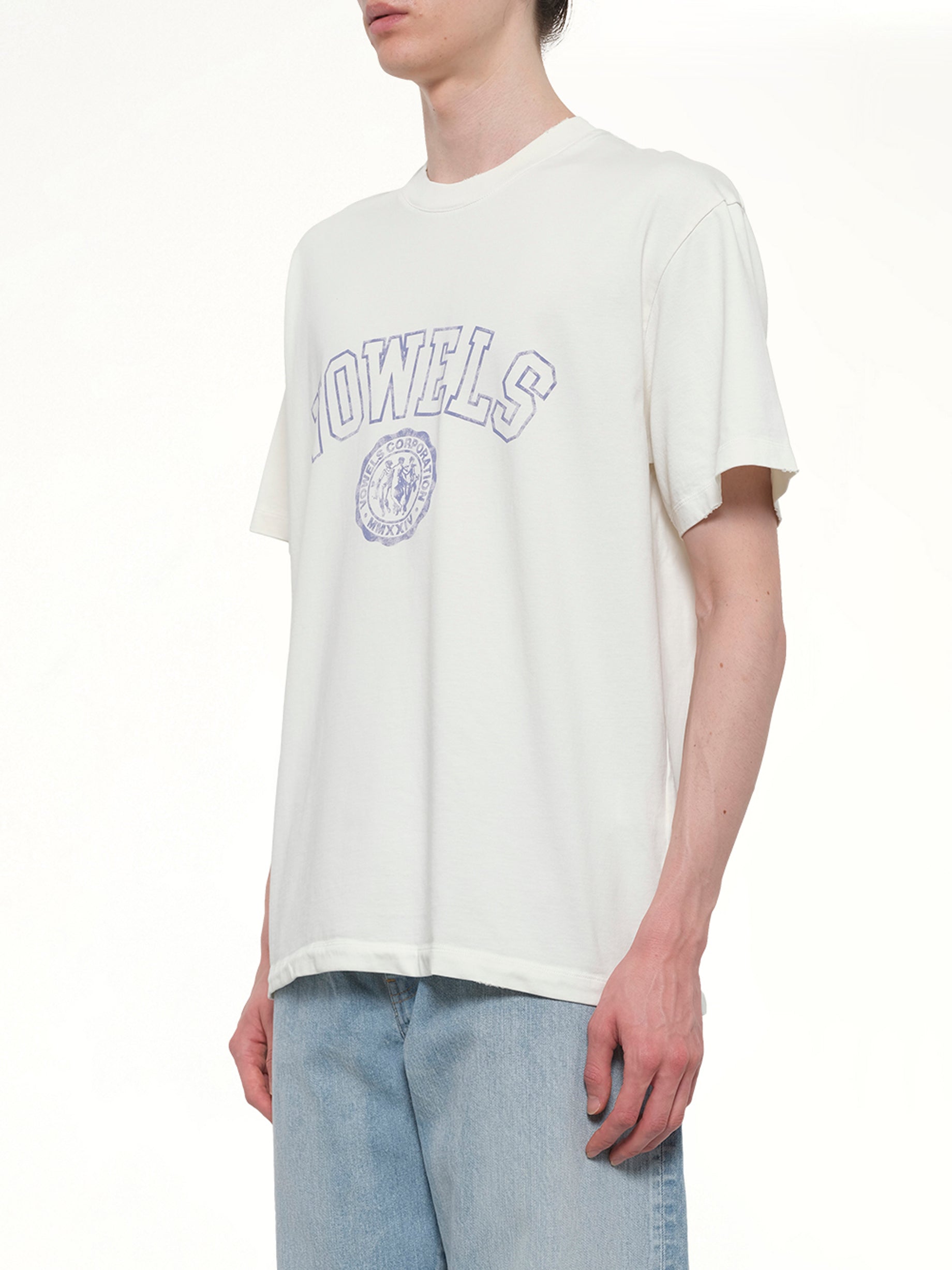 VOWELS Faded Collegiate T-Shirt in White Side View from MARAIS