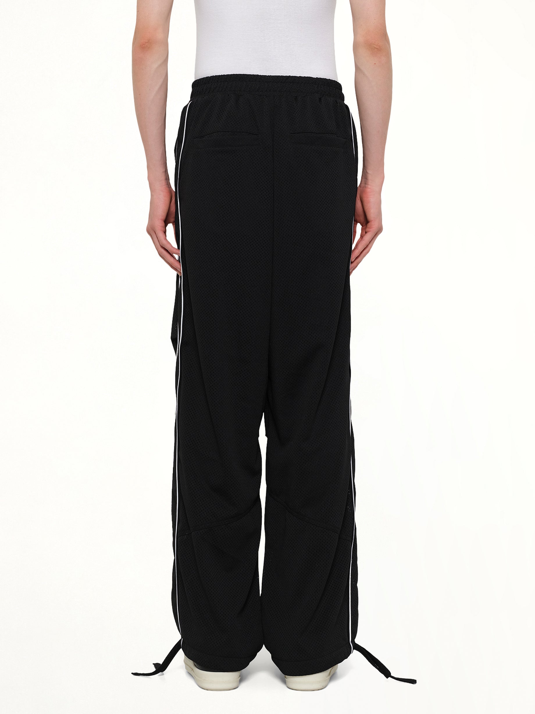 RHUDE Rhude Mesh Piping Parachute Track Pant in Black/White Back View from MARAIS