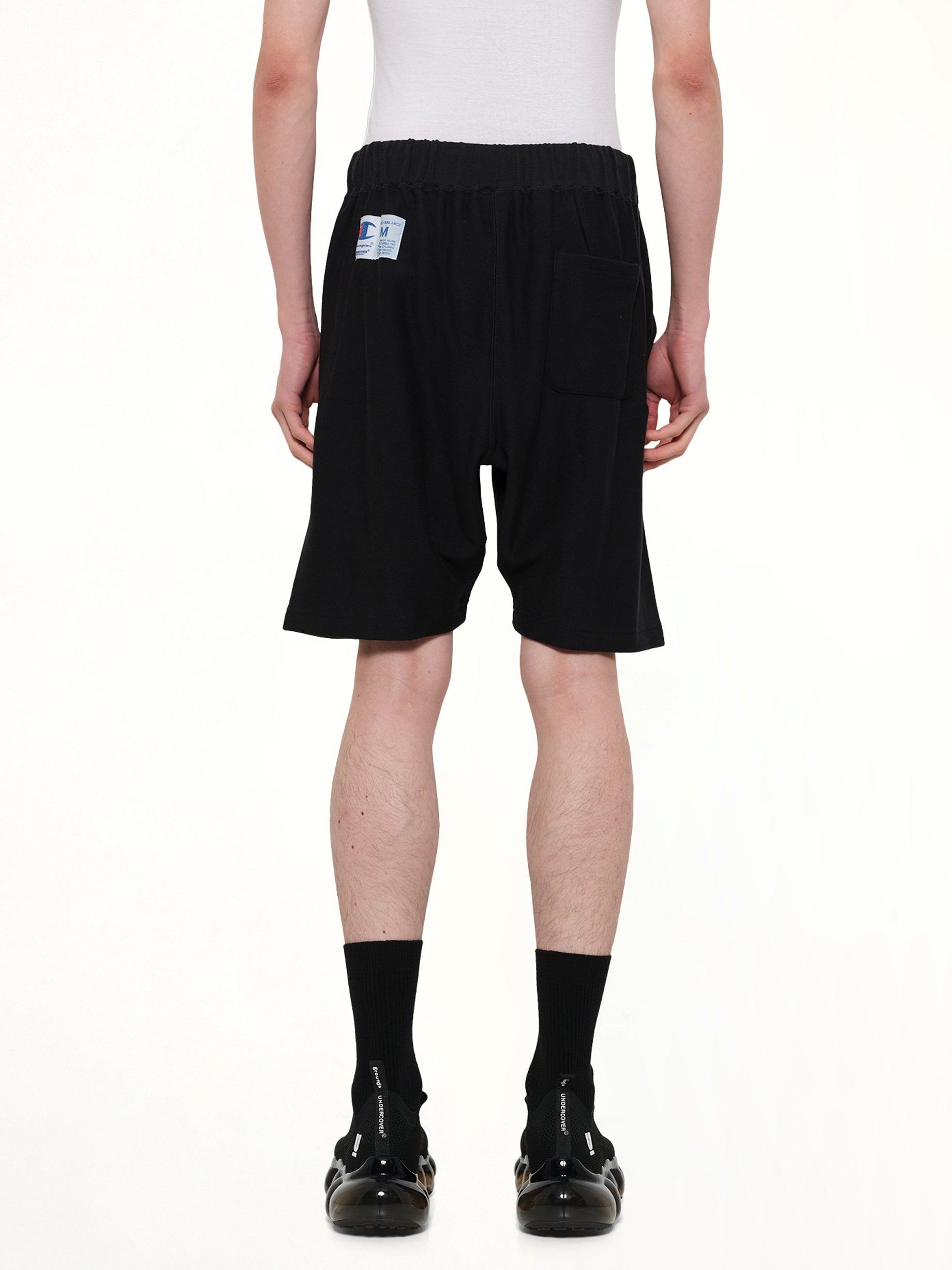 UNDERCOVER Champion x UC Sweatshorts in Black Back View from MARAIS
