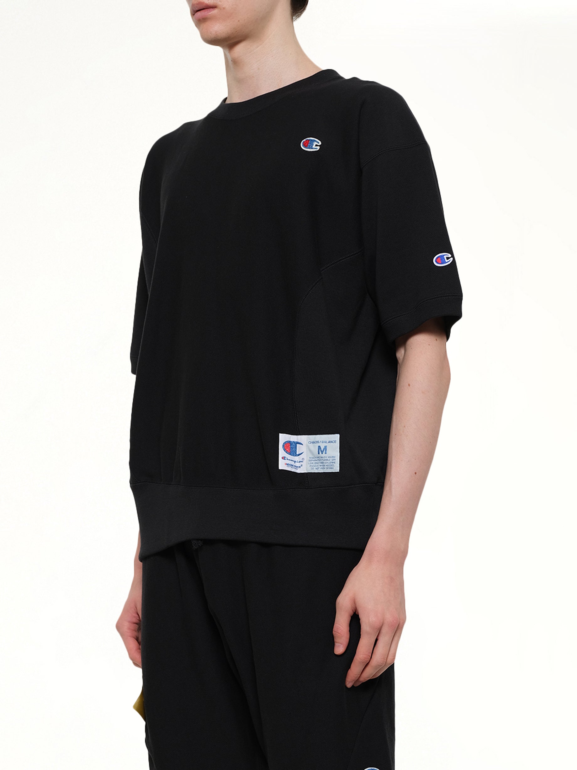 UNDERCOVER Champion x UC Sweat Top in Black Side View from MARAIS