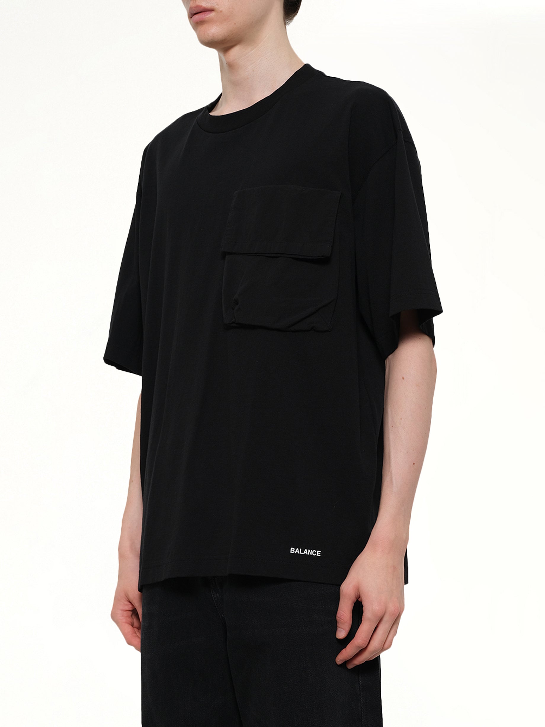 UNDERCOVER Chaos Balance Pocket T-Shirt in Black Side View from MARAIS