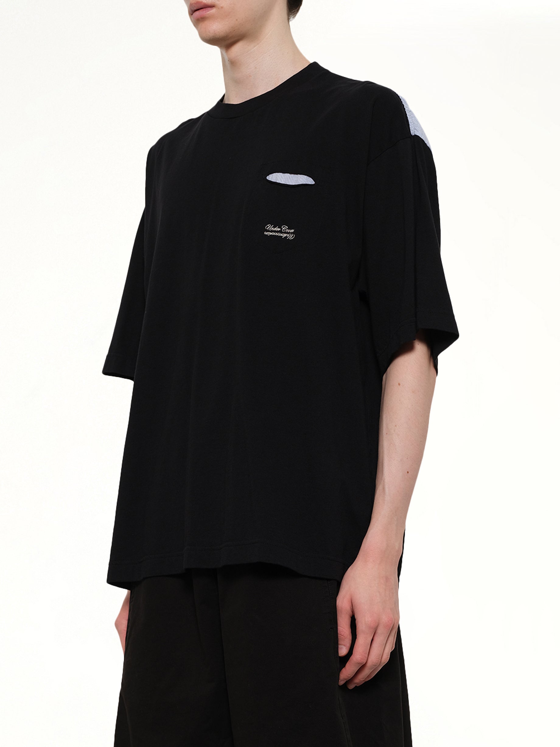 UNDERCOVER Combo Pocket T-Shirt in Black Side View from MARAIS