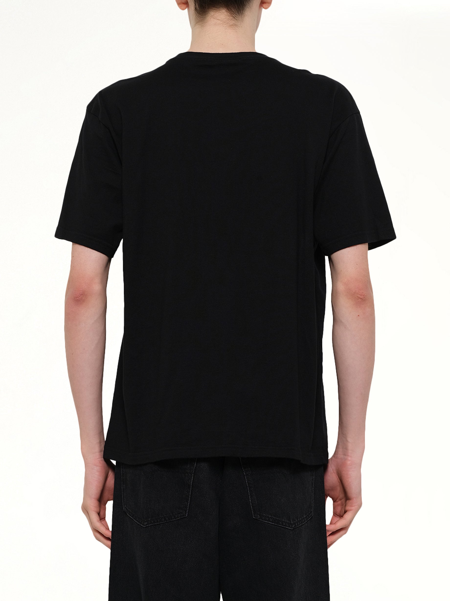 UNDERCOVER Everybody Needs U T-Shirt in Black Back View from MARAIS