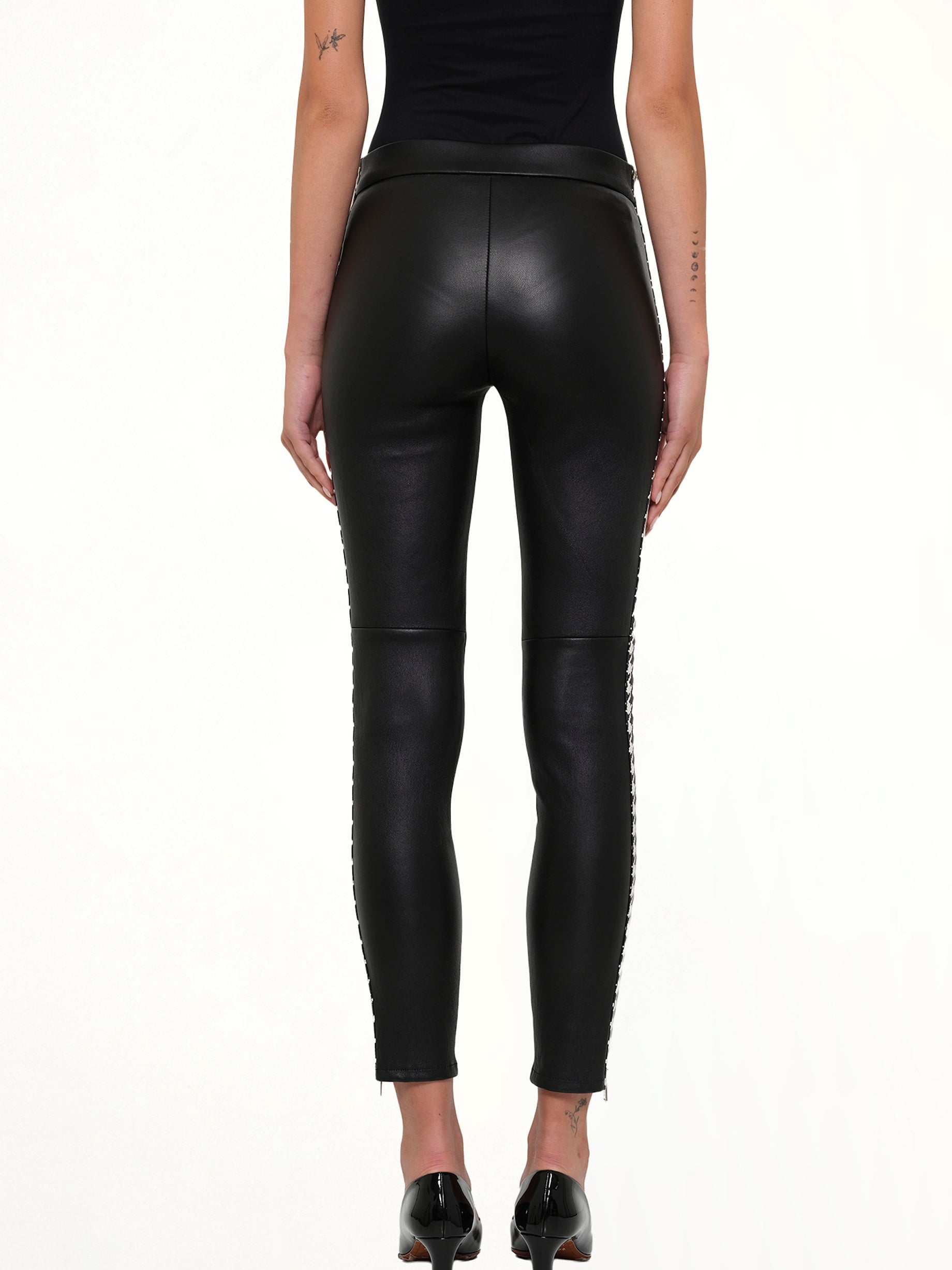 ALEXANDER MCQUEEN Leather Leggings in Black Side View from MARAIS