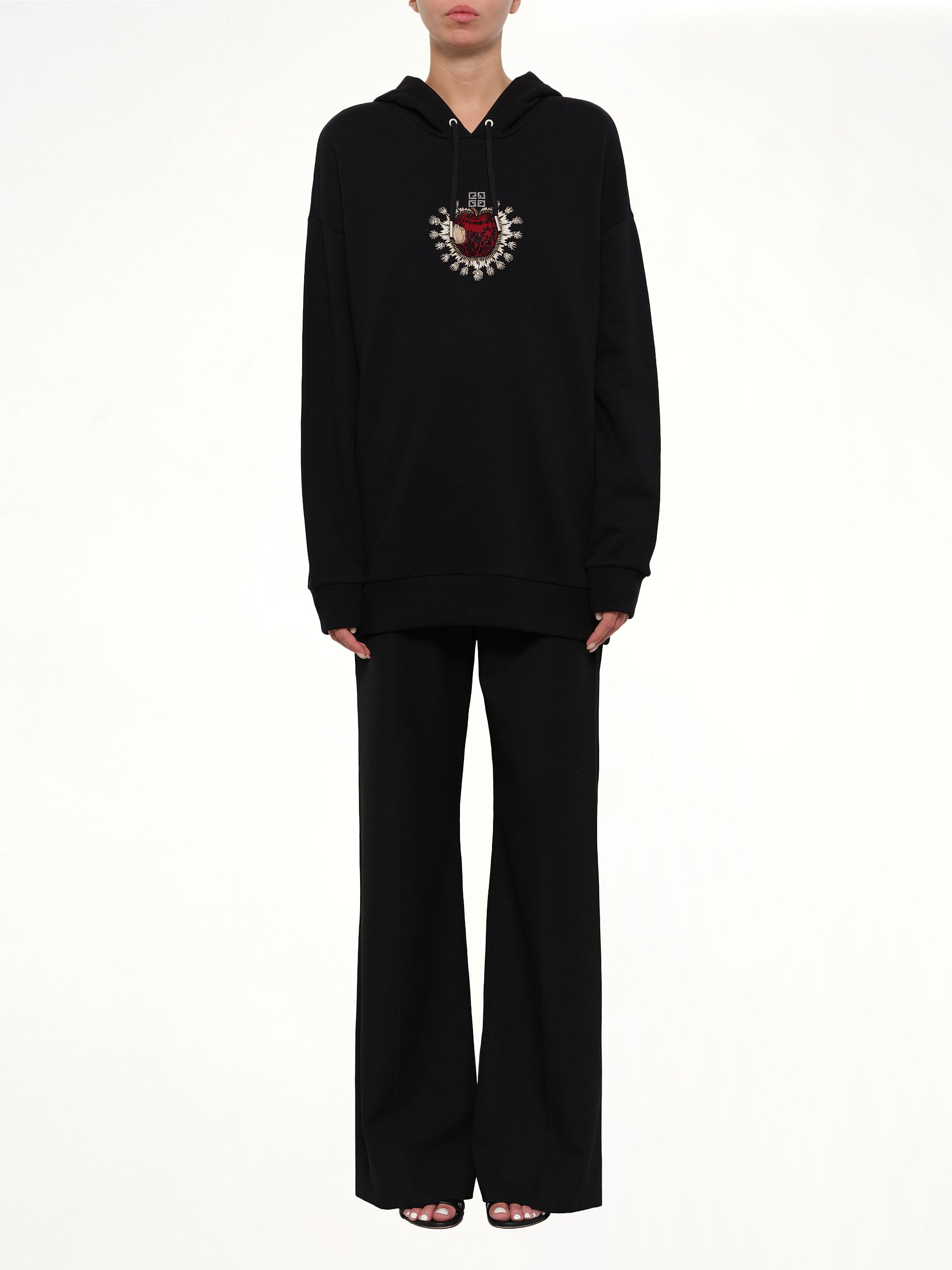 GIVENCHY Sacred Apple Hoodie in Black Product Photo from MARAIS