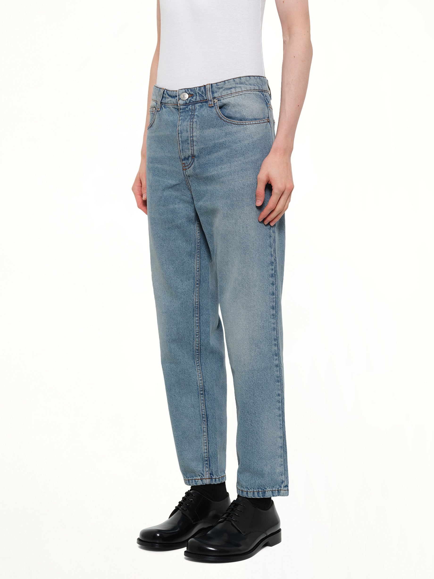 AMI PARIS Tapered Fit Jeans in Blue Side View from MARAIS