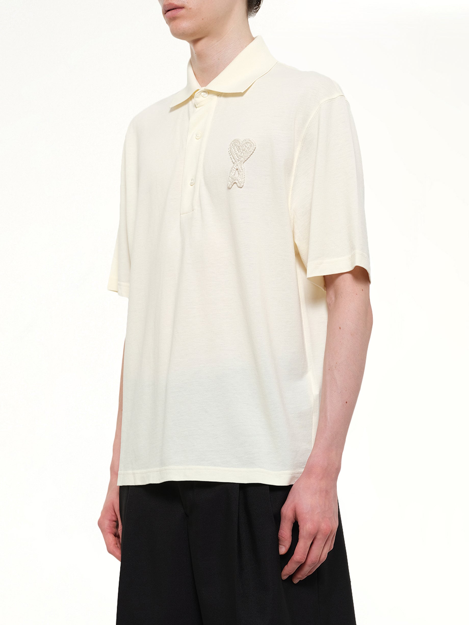 AMI PARIS Knitted ADC Boxy Polo in Off White Side View from MARAIS